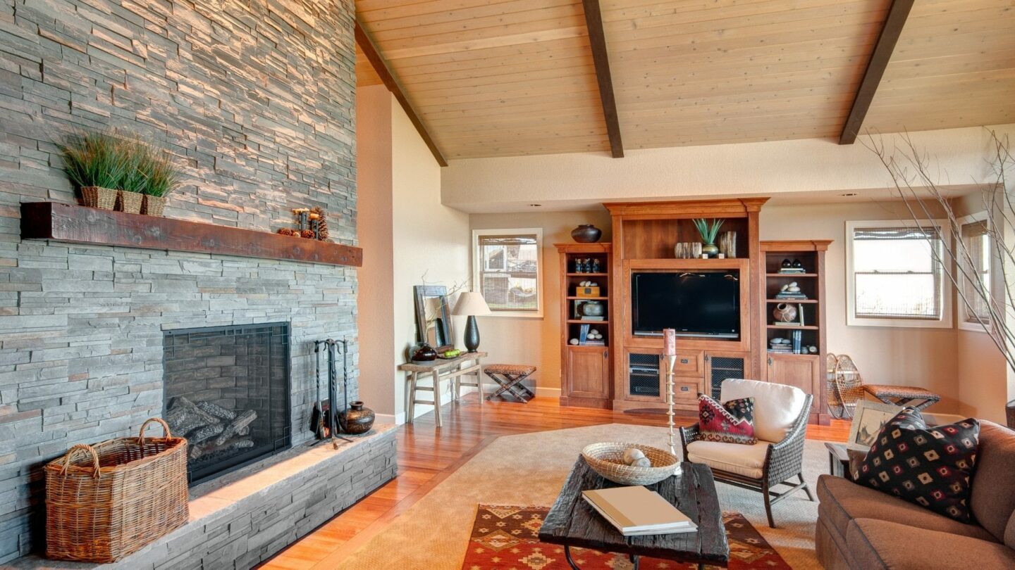 fancy living room with stone wood-burning fireplace. Prepare For Winter With A Fireplace Installation