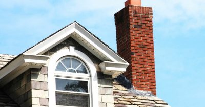 A brick chimney that needs chimney maintenance