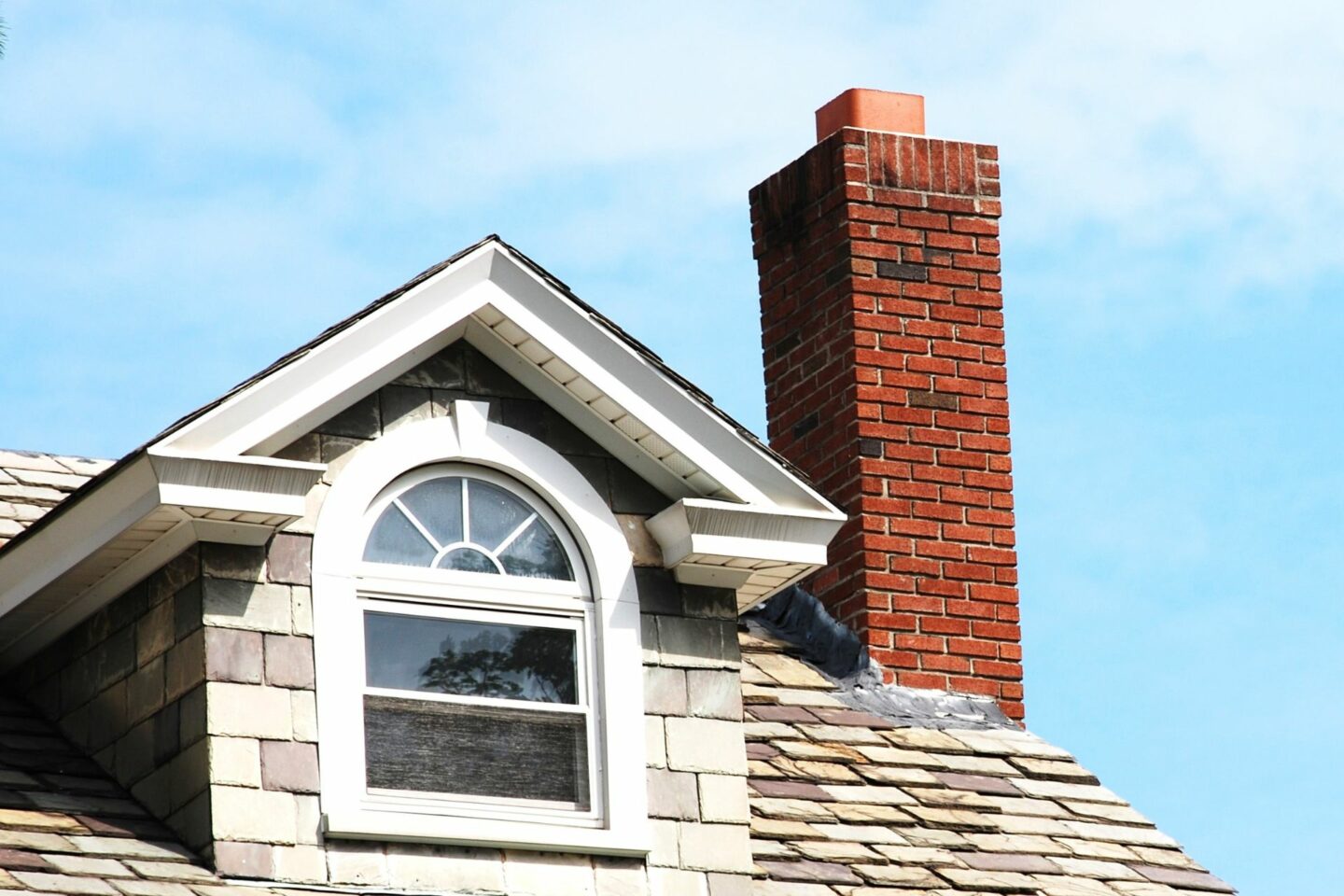 A brick chimney that needs chimney maintenance