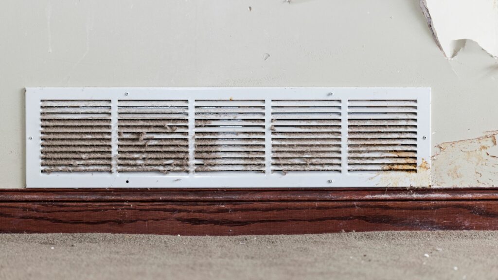 A dusty vent that signals the need for air duct repair